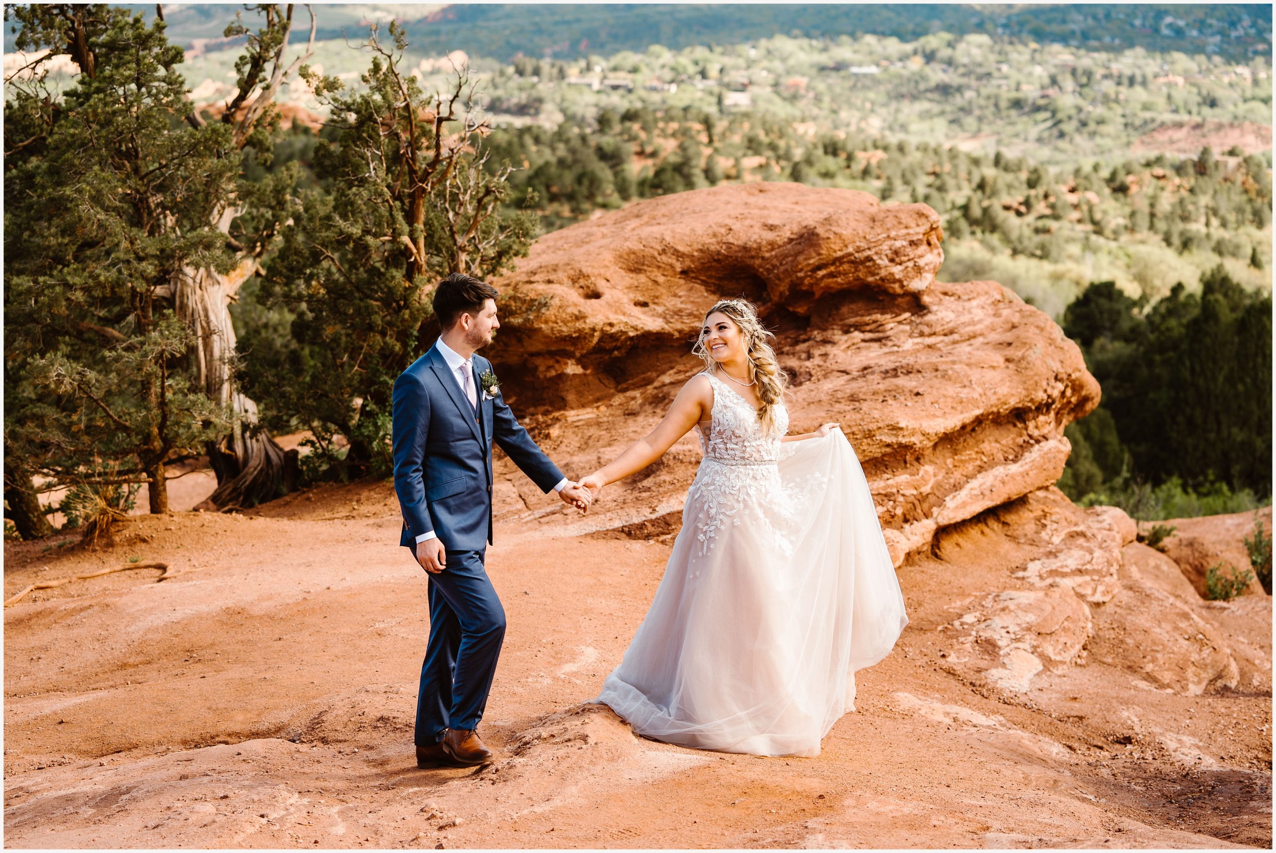 Bride and groom eloping near red rocks by Colorado Springs