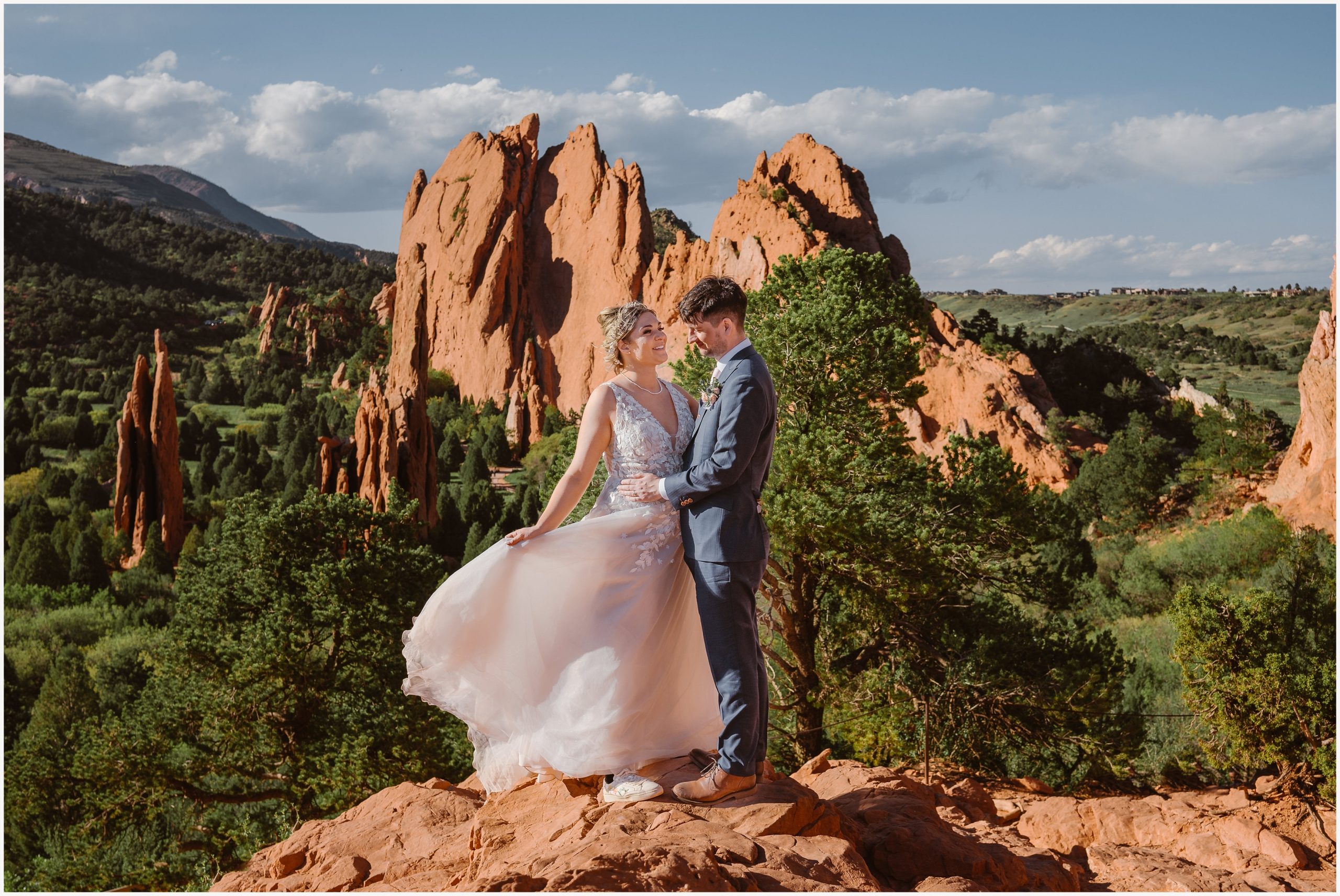 Elopement Guide Colorado Springs wedding dress blowing in the wind