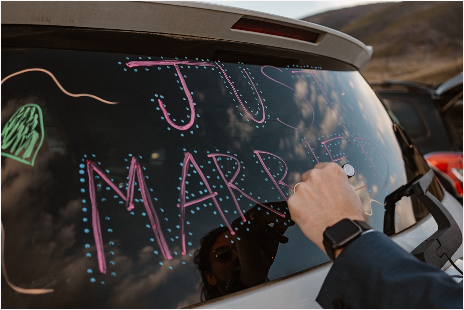Couple writes just married on their car after elopement