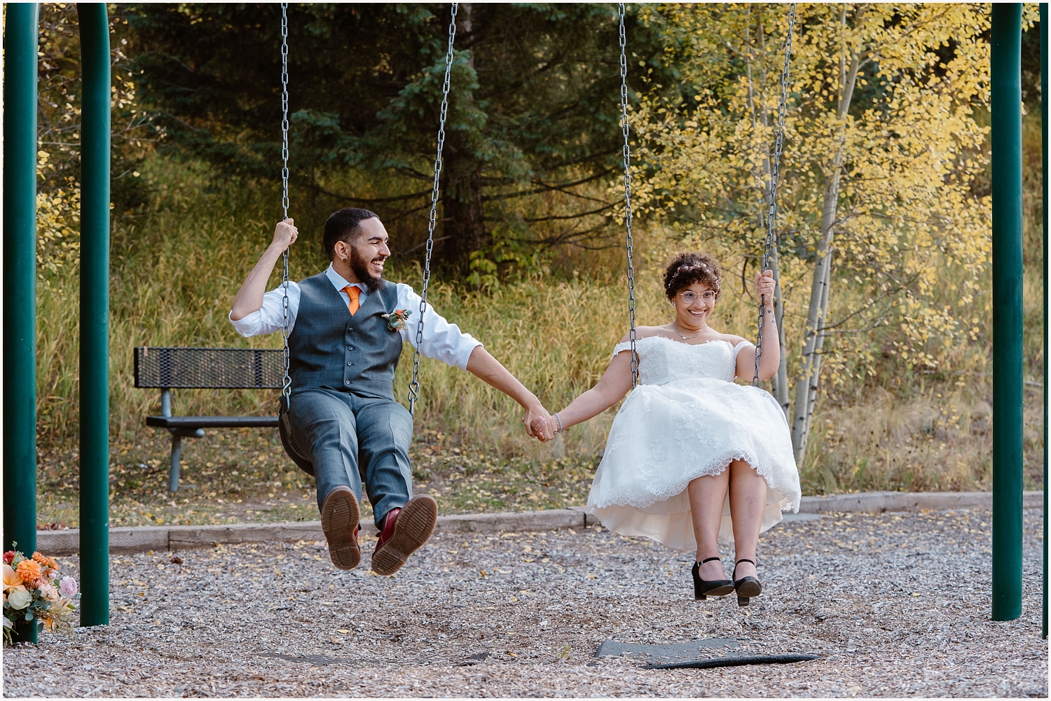 Couples swings on swing set during elopement day