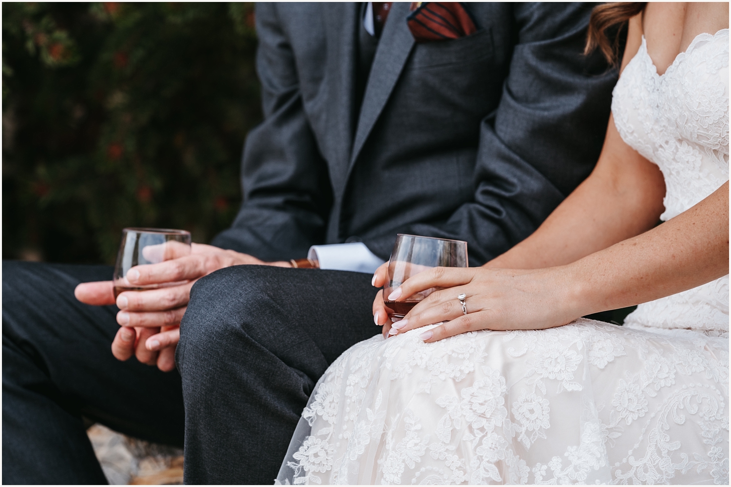 Bride and groom holding cocktails on their elopement day