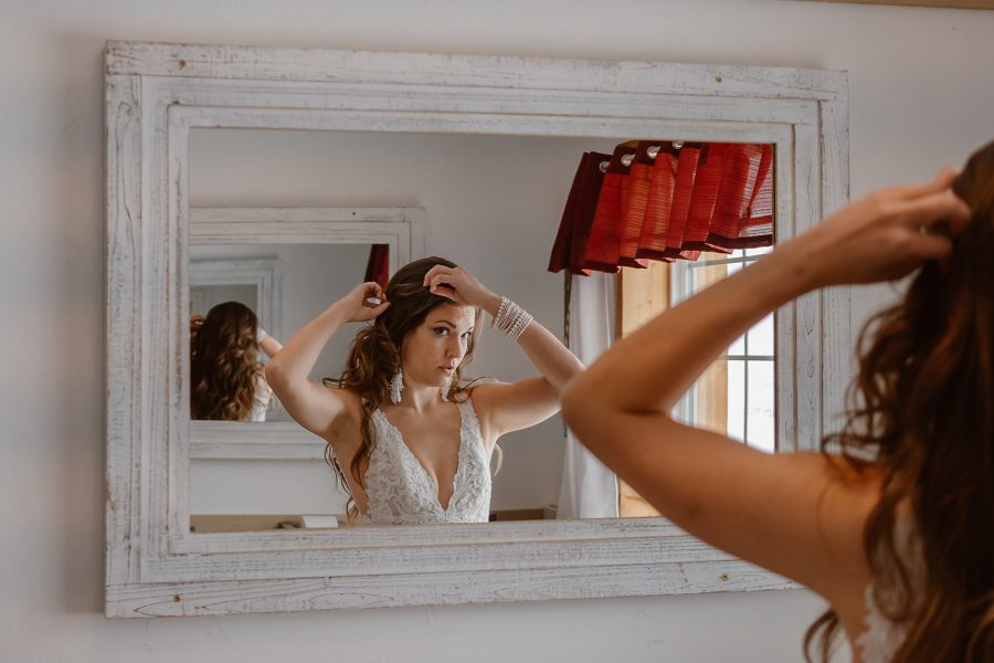 The bride gets ready during her winter Telluride elopement. 