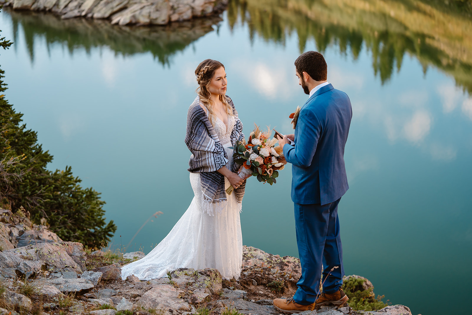 This couple looks meaningfully at each other during their Colorado adventure elopement.
