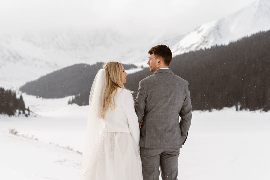 A bride and groom look into each others' during their Breckenridge Ski Resort elopement.
