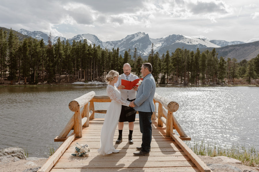 A couple says their wedding vows on Sprague Lake in RMNP during their Sprague Lake elopement.
