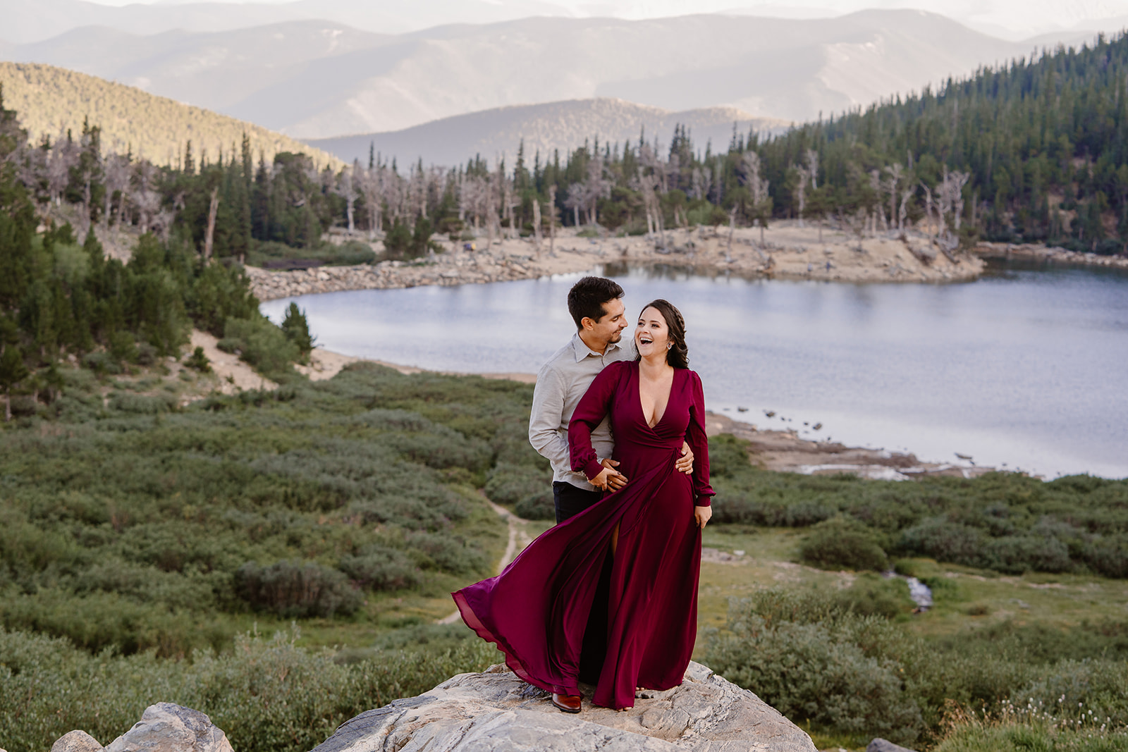 A bride and groom show off their non-traditional wedding-day attire during their Colorado elopement.
