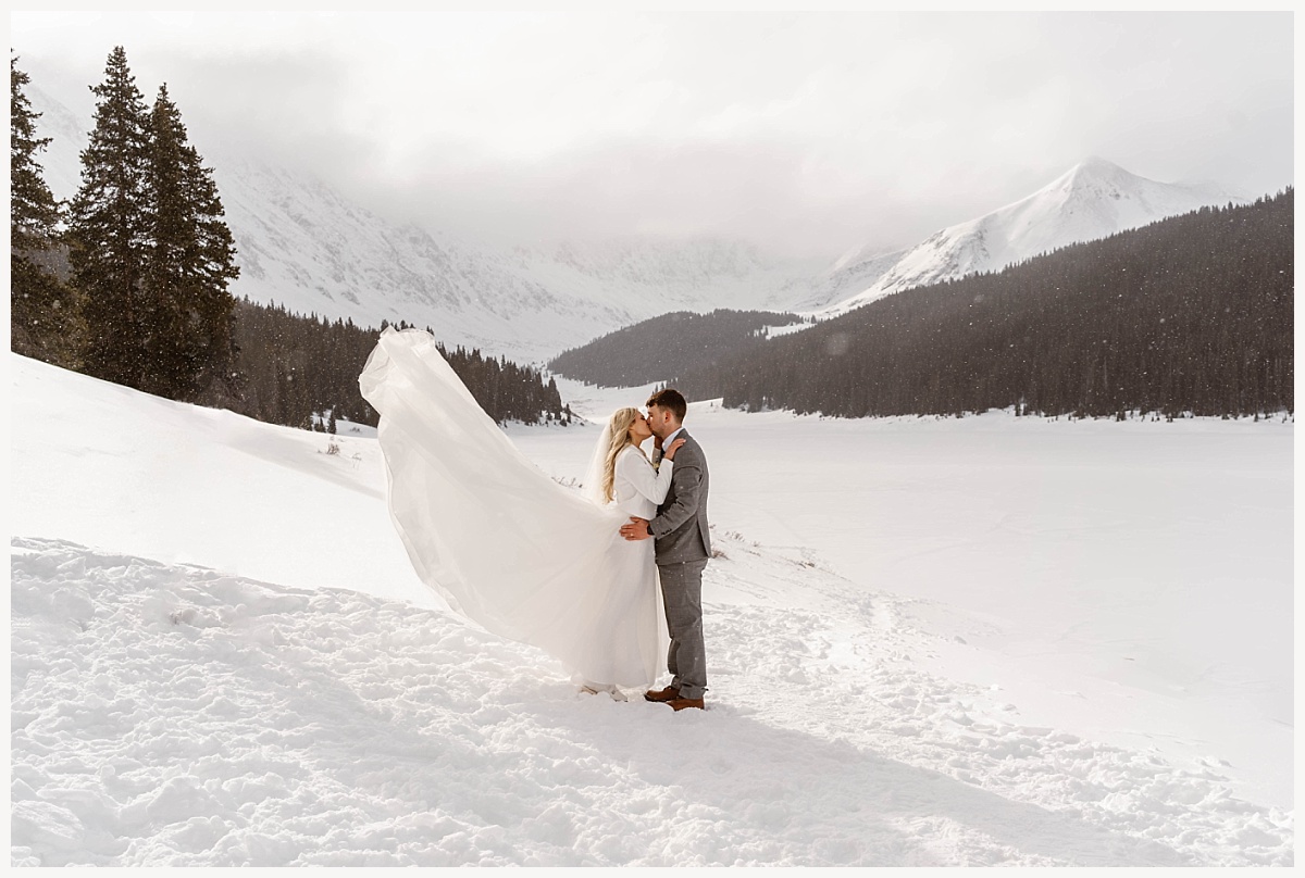 Couple kissing during their Winter Elopement