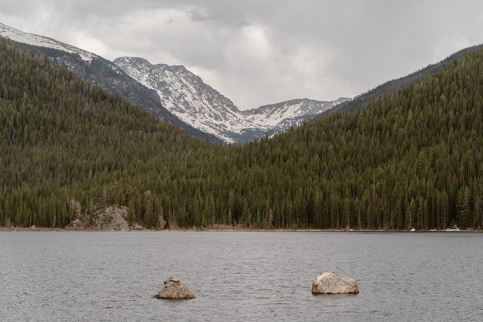 An image of Lake Granby is shown, an ideal spot for a couple's adventure elopement ceremony.