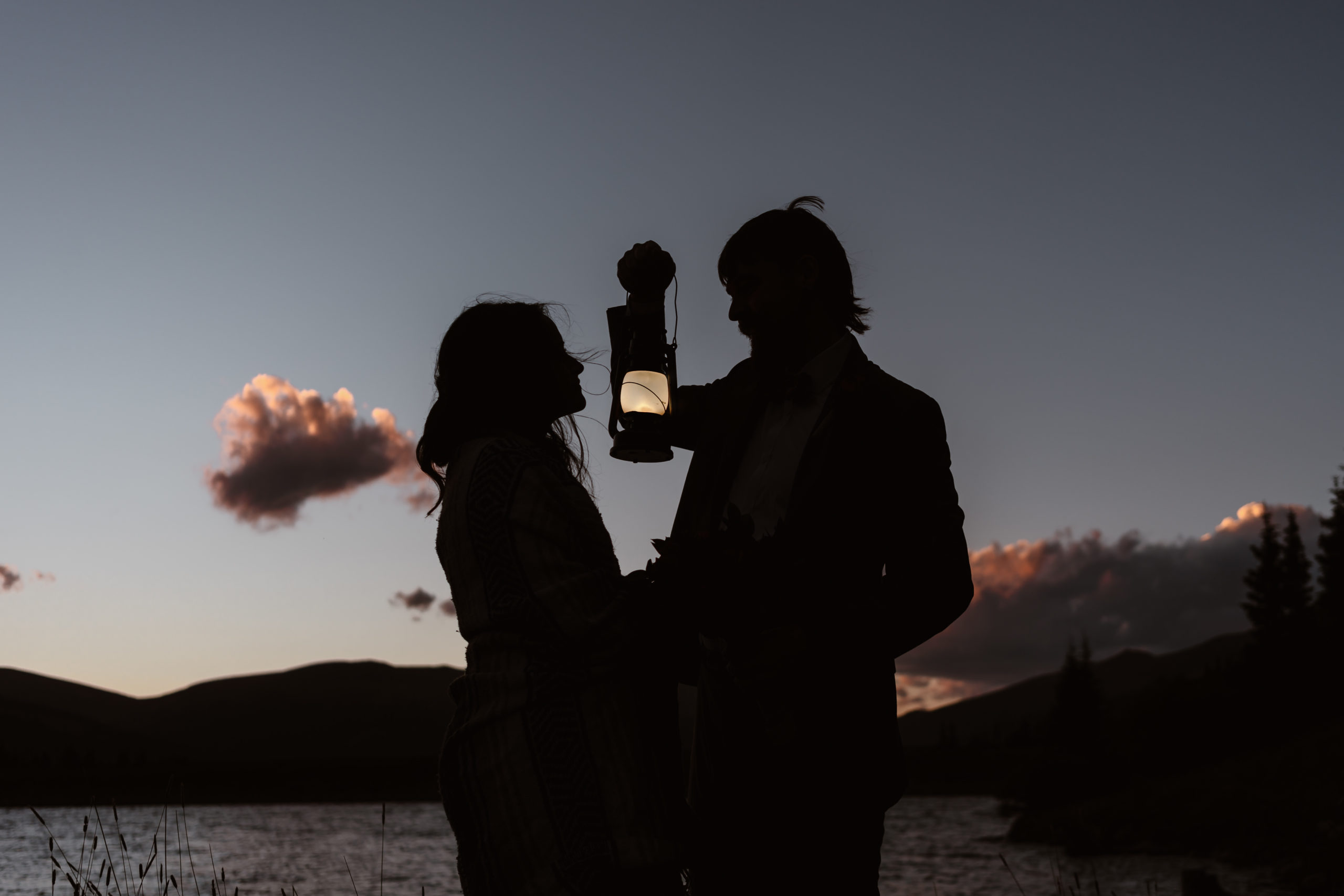 A couple's silhouette is shown as the sun sets in the background on their Breckenridge mountain elopement.