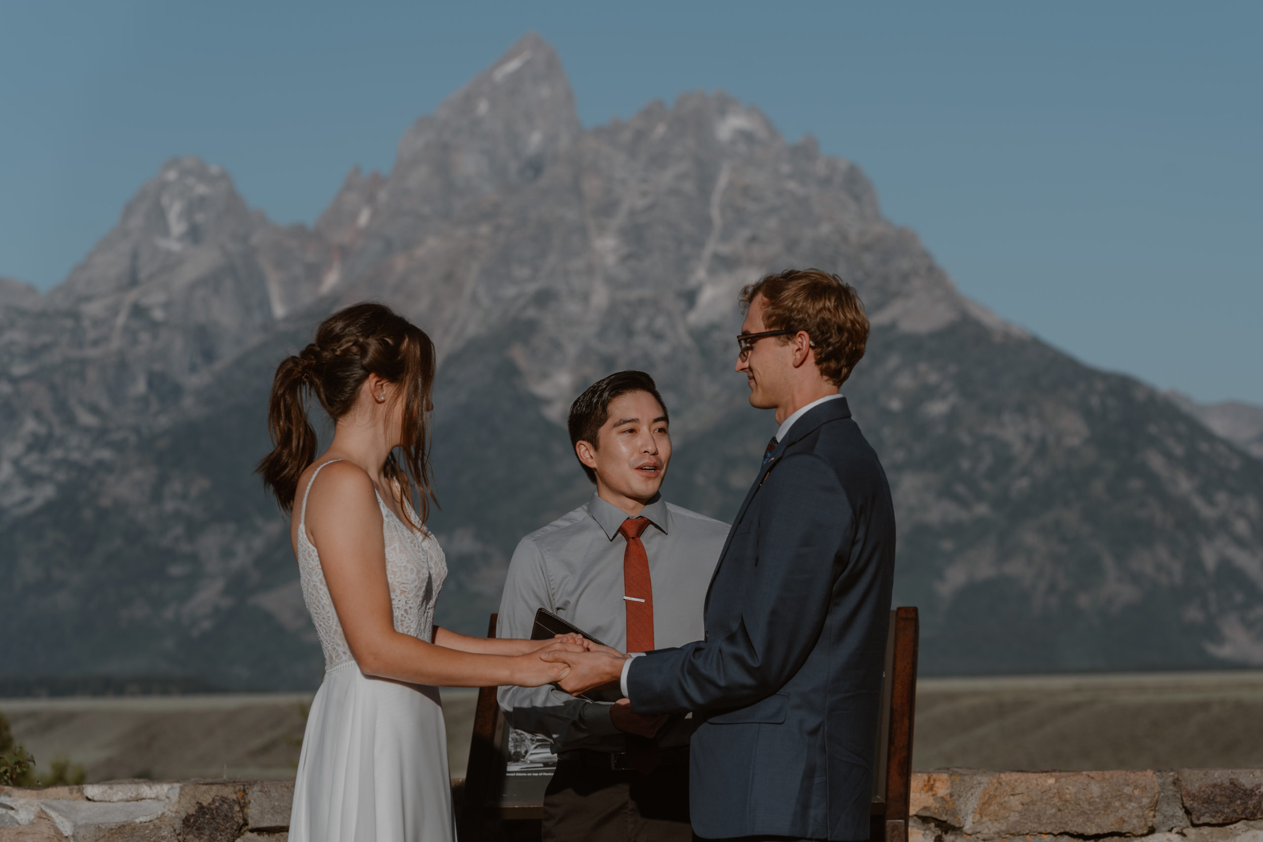 A bride and groom share their vows in front of their family and friends during their Grand Teton National park elopement.