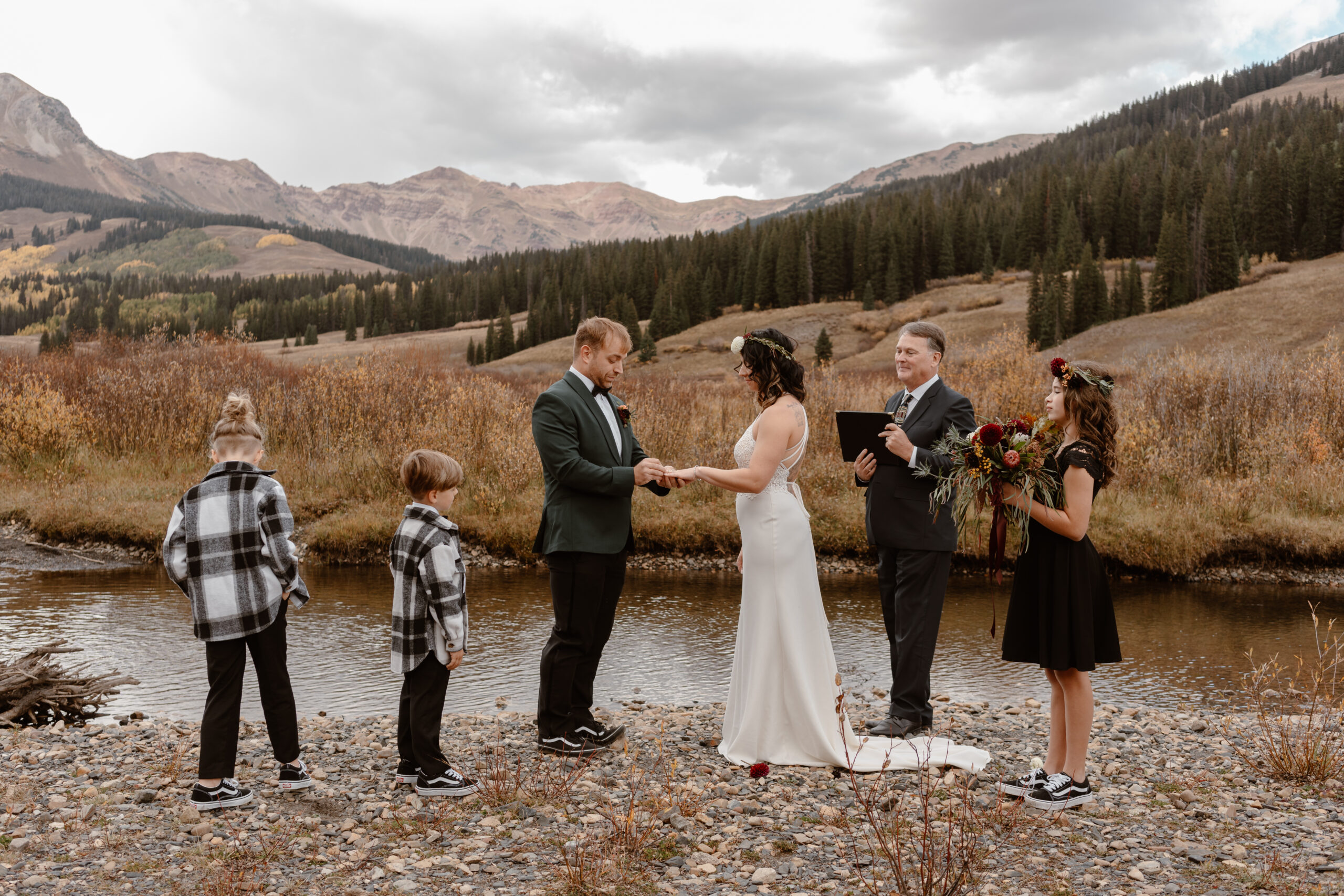 A bride, groom, and their blended family all take part in their elopement ceremony in Colorado.