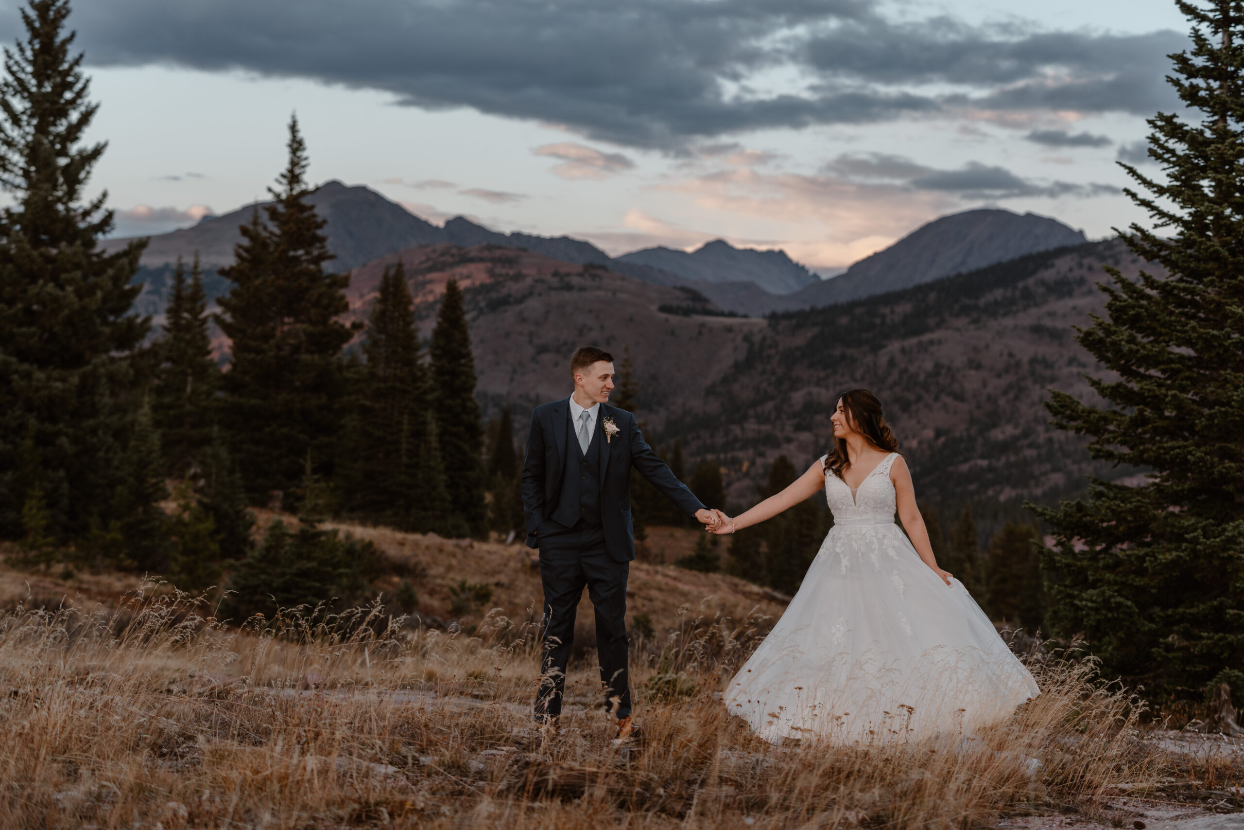A bride and groom take in the views during their Fall Vail elopement.