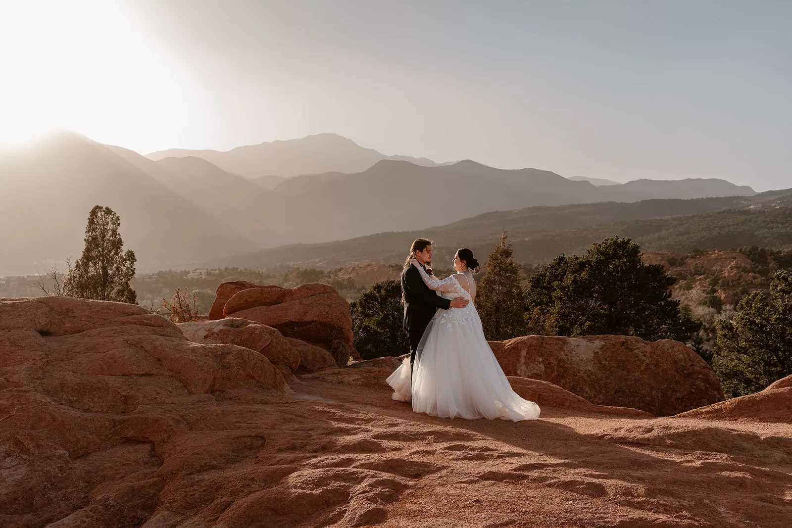 A bride and groom have their first dance during their Colorado Garden of the Gods elopement.