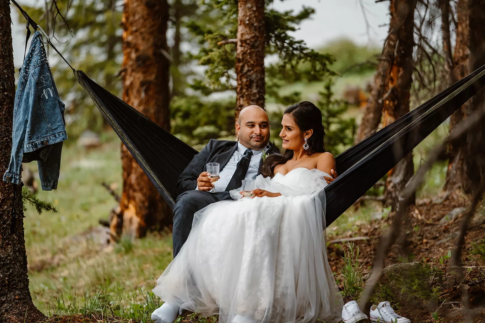 A bride and groom hammock during their Colorado elopement ceremony.