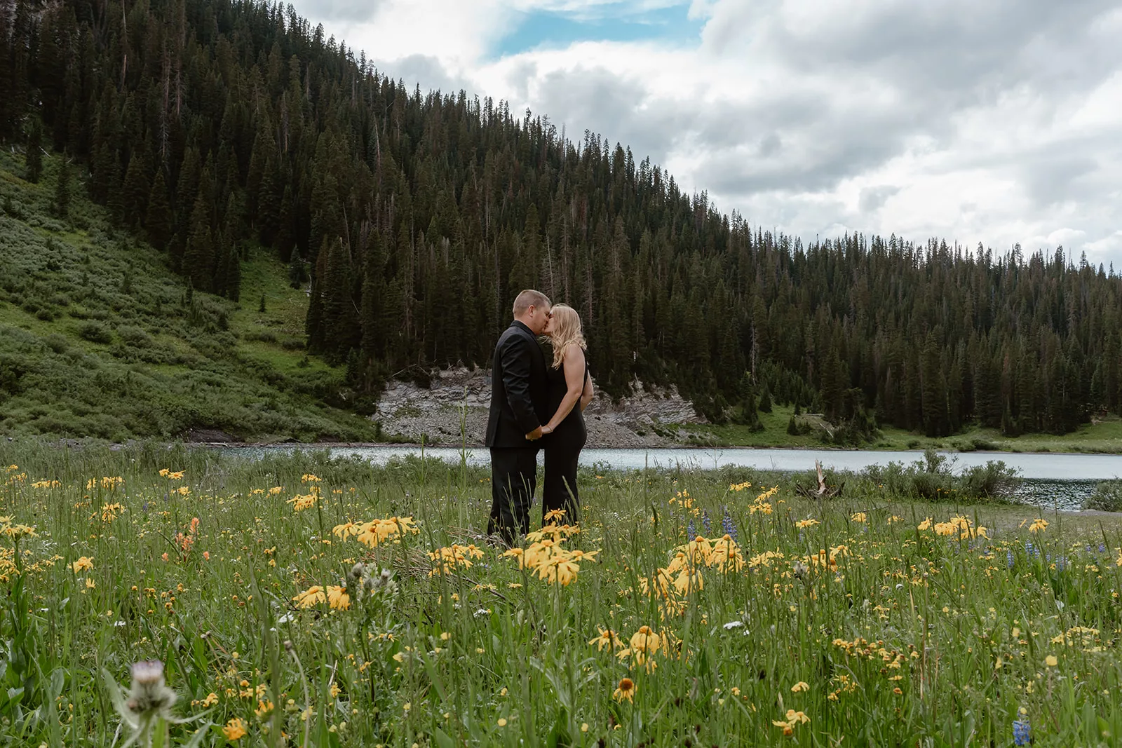 A couple in all black gets married during their adventure elopement in Crested Butte.