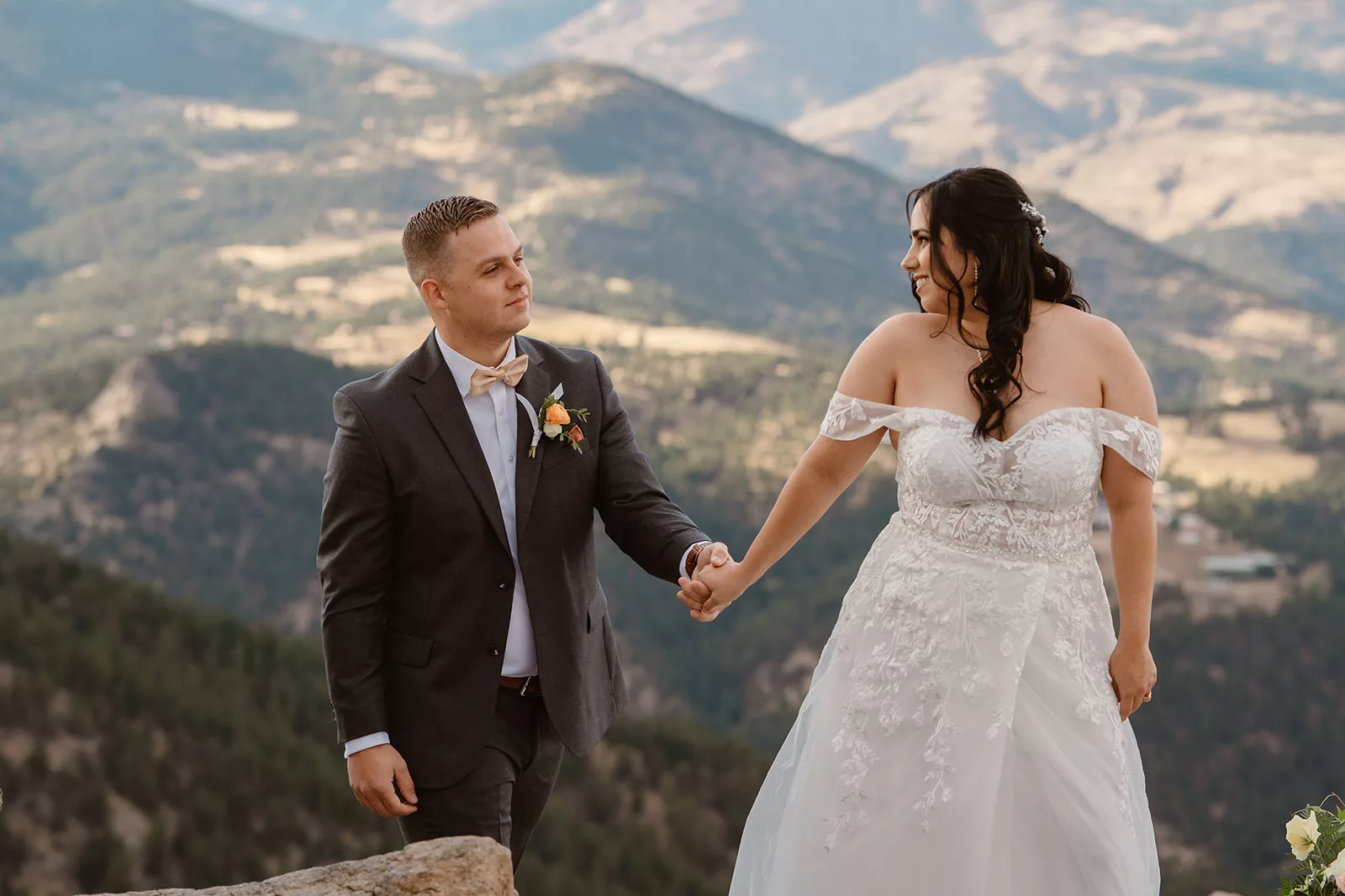 A bride and groom soak in the views around them during their adventure elopement in Colorado.