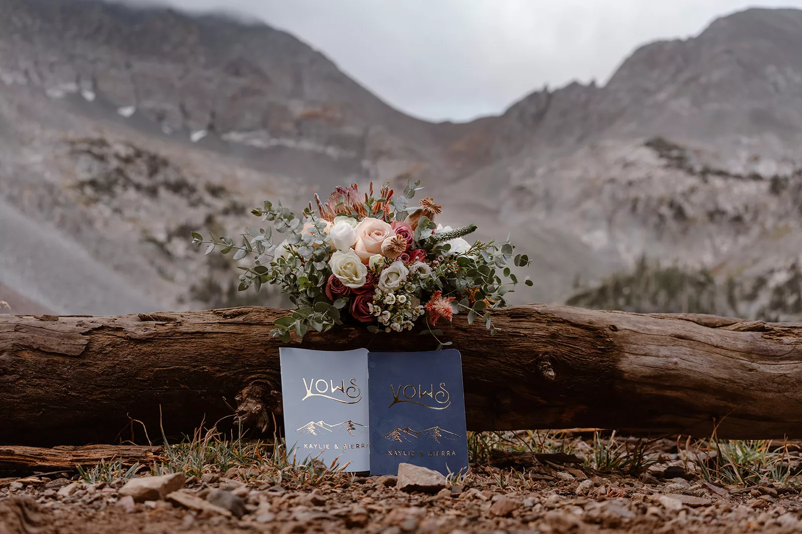 This image shows personalized vow books along with florals during a couple's adventure elopement in Colorado.