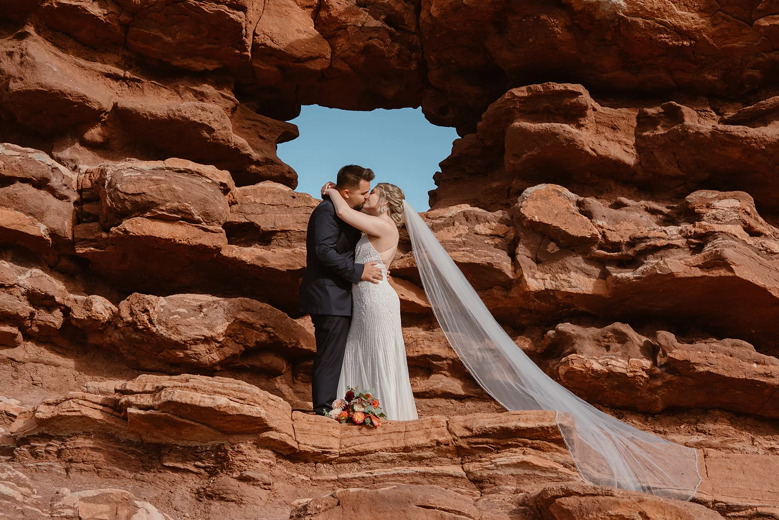 A couple holds eachother close during their Garden of the Gods elopement. 