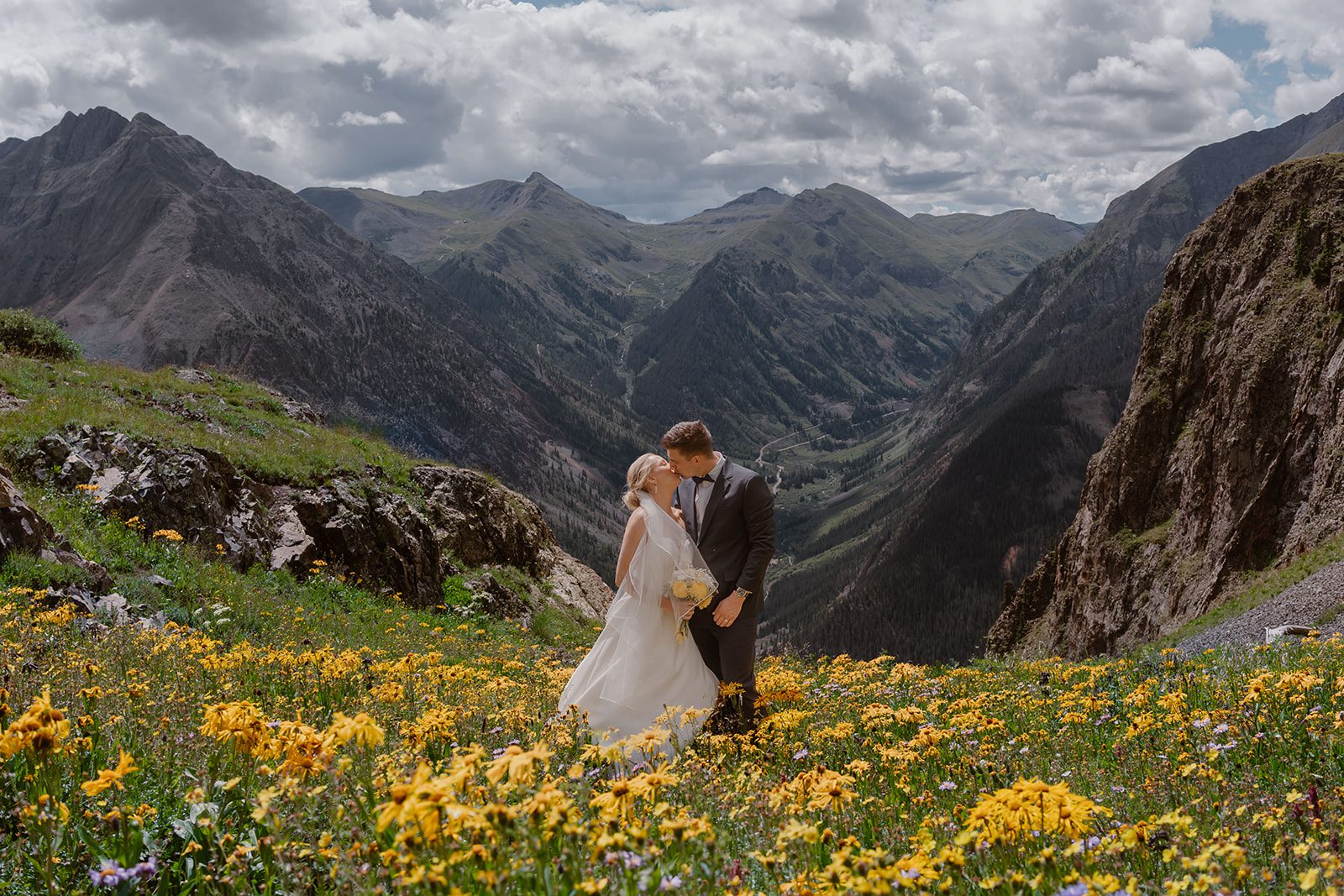 A bride and groom share a kiss during their San Juan mountain elopement.