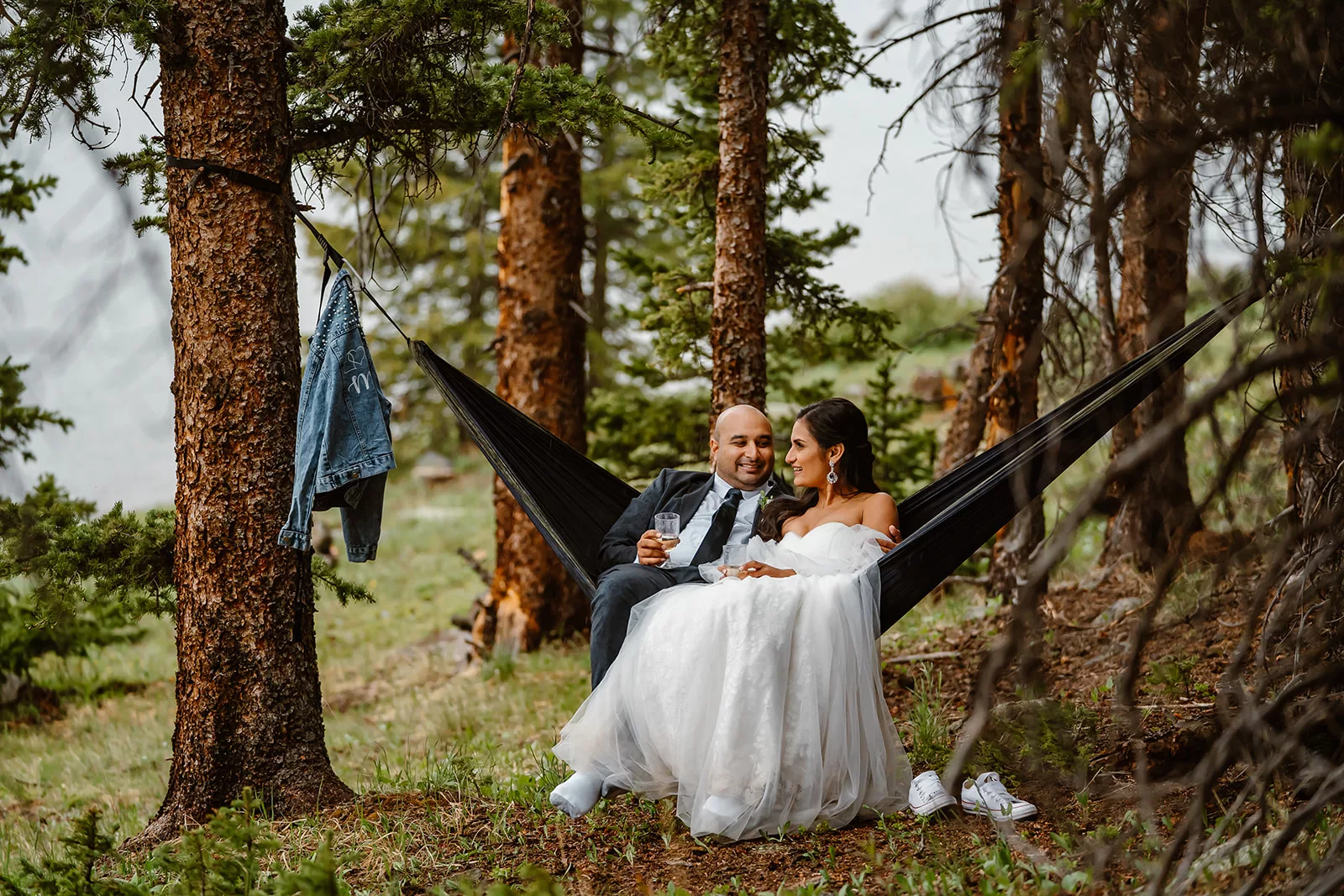 A couple relaxes in their hammock during their private, just-them elopement.