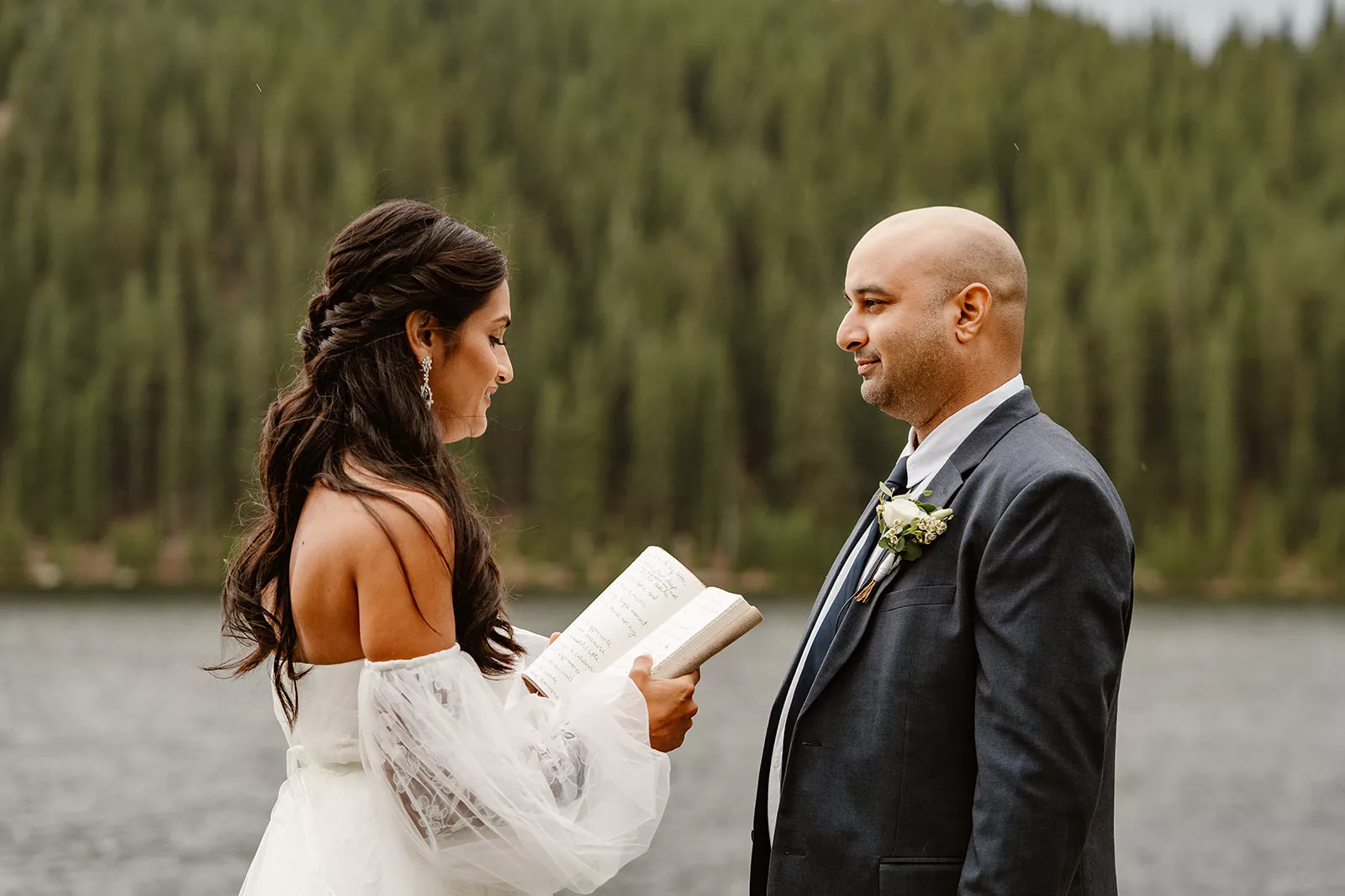 A couple reads their private vows to each other during their Colorado private elopement ceremony.