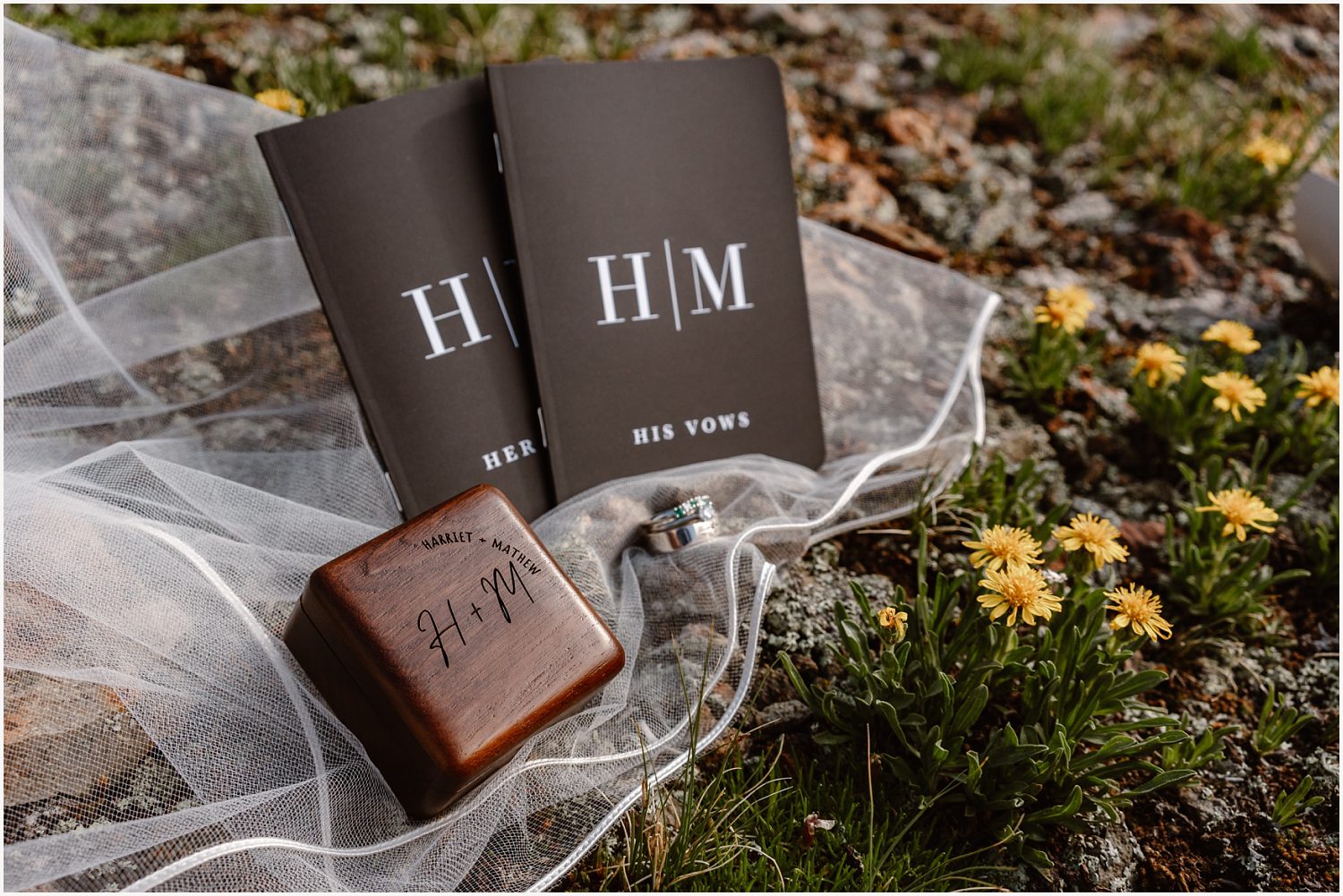 Detail shot of vow books and rings, capturing the essence of the couple's elopement.