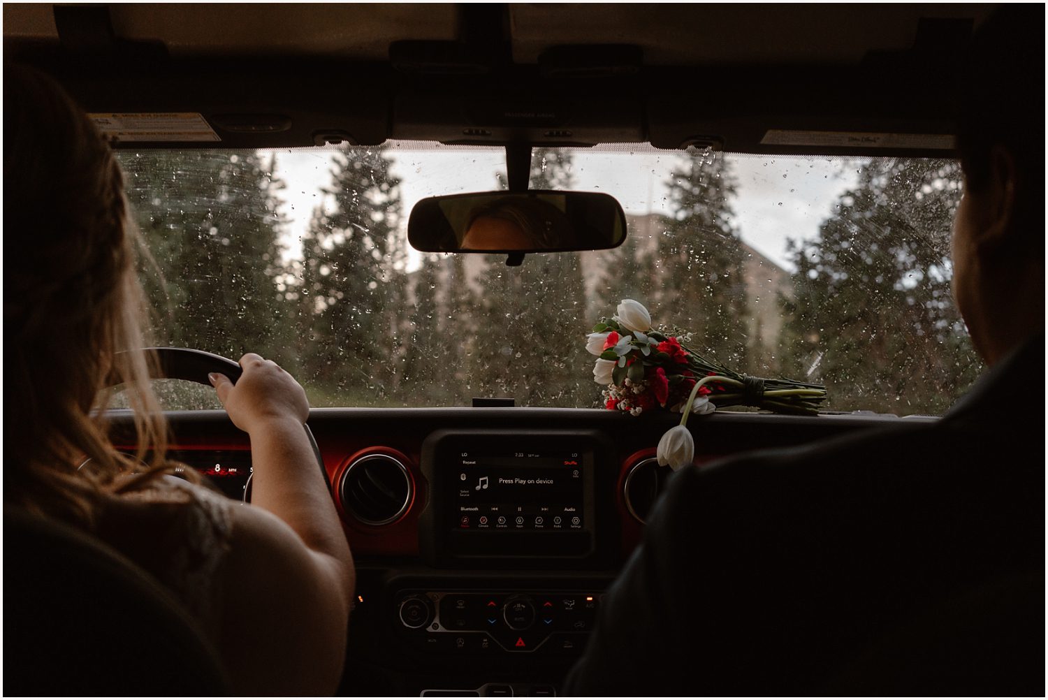 Elopement photographer capturing a couple in the mountains during their off-roading elopement planning.