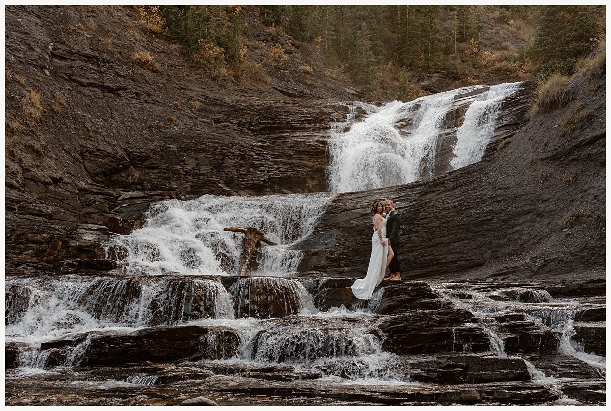 couple eloping by waterfall, Should I elope, How do I elope, Is eloping right for me, colorado elopement, elopement, colorado elopement photographer, colorado elopement photography,